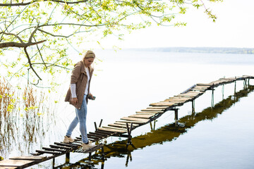 The shore of the river with little bridge fisherman