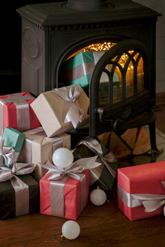 A mountain of gifts falls out of the magic fireplace