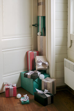 A mountain of wrapped New Year's gifts near the door