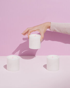 Minimal arrangement of white scented candles