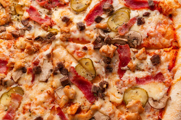 Italian cuisine. Pizza with assorted stuffing close-up. Top view