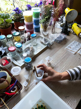 Woman doing homemade orgone pyrimids