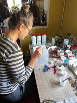 Woman doing homemade orgone pyrimids