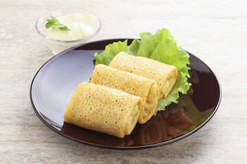 Stuffed pancakes with meat and cream