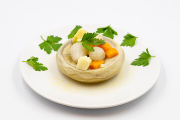 Artichokes with olive oil on white background. Traditional delicious Turkish food; (zeytinyagli enginar). Horizontal view. Close up