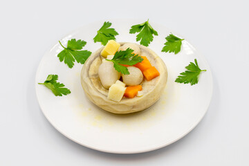 Artichokes with olive oil on white background. Traditional delicious Turkish food; (zeytinyagli enginar). Horizontal view. Close up