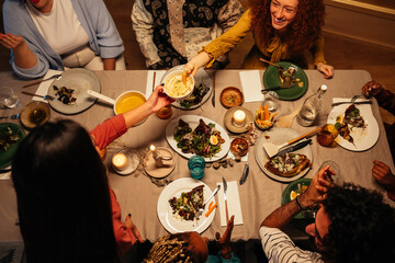 Friends sharing food during dinner