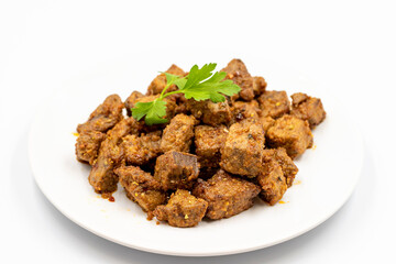 Fried liver cubes on a white background. Turkish Traditional Food Arnavut Cigeri. Horizontal view. Close up