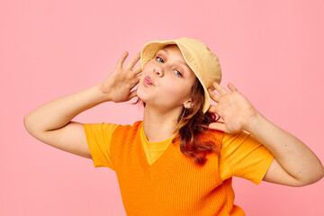 pretty woman in an orange sweater in yellow hat hand gesture cropped view unaltered