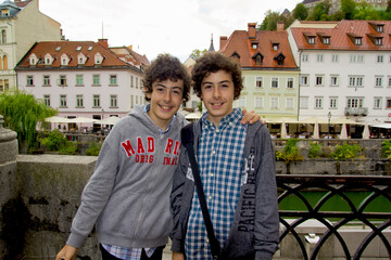 Fototapeta na wymiar handsome twins smiling at camera in ljubljana, slovenia