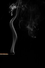 Wooden matches with fire on a black background