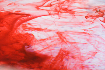 Color swirl splash red water on white background.