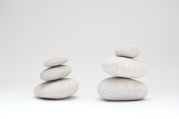 Obraz na płótnie Canvas Stacks of Pebbles stones balance on white background