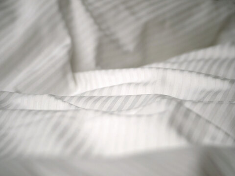 Hotel bed white sheets detail