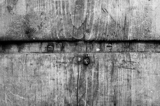 Old worn out wooden board. Wood texture close up. Black and white textured natural background.