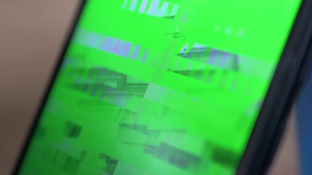 Signal Distortion, Interference, Glitches on the Screen of a Smartphone, Mobile Phone. Digital video transmission error, purple, green stripes, pixel noise. Technical problem, lack of internet, web.