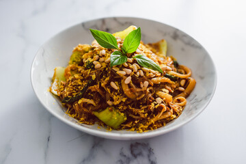 vegan udun and vermicelli noodles mix wih pak choy and spicy sauce, healthy plant-based food