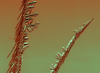 Blue-pink patterns from frost on glass as a background.