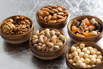 dried fruit and various nuts on plates