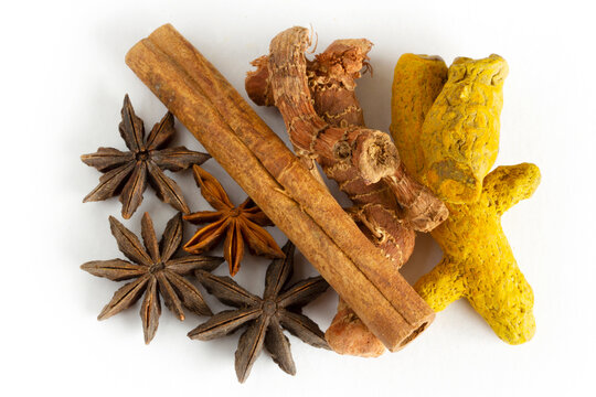 Healthy spices on a white background. Turmeric, ginger, star anise, cinnamon sticks..