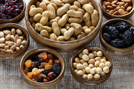 dried fruit and various nuts on plates