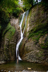 
A beautiful waterfall in the Krasnodar Territory. The majestic landscape of the waterfall.