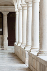 White stone colonnades in the cloister of St Francis church and Franciscan monastery in Zadar, Croatia