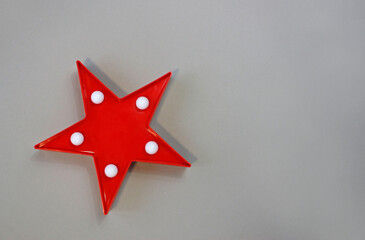 Fototapeta na wymiar Decorative star with lamps. Stylish star shaped glowing night lamp. Space for text.