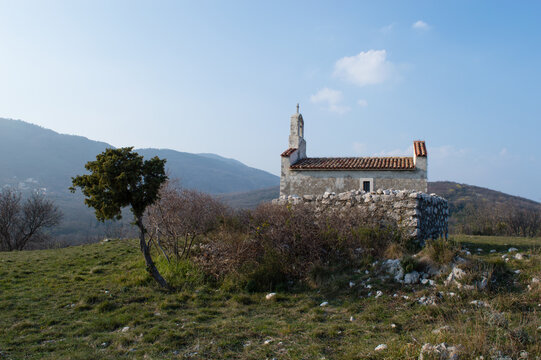 Small church in the countryside, church St Mary Magdalene from 15th century located on top of the hill in Brseč, small village in western Croatia