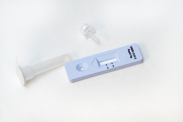 Corona Antigen Rapid Test kit and masks on white background