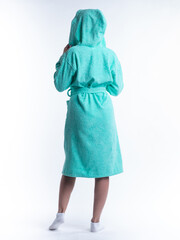 woman in a dressing gown from the back on an isolated white background.