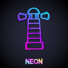 Glowing neon line Lighthouse icon isolated on black background. Vector