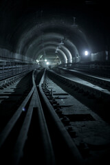 Underground facility with a big tunnel leading deep down. Metro - subway construction site.