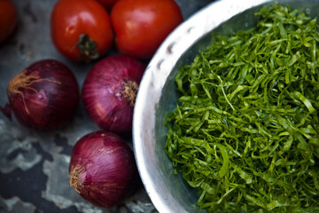 Tomatoes and onions on a kitchen cooking boards. Food background.