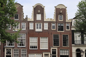 Fototapeta premium Canal House Facades wth Neck Gables in Amsterdam, Netherlands