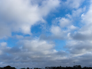 Fototapeta na wymiar lovely fluffy white clouds in the sky above Sydney NSW Australia