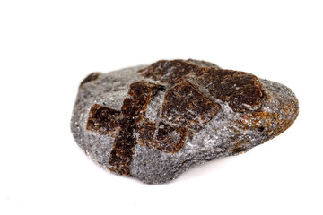 macro mineral stone Staurolite on a white background