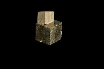 Macro mineral stone Pyrite on a black background