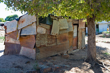 A ramshackle dwelling made from corrugaged metal sheets