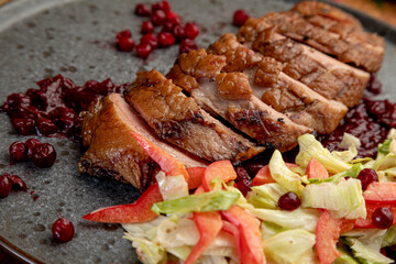 smoked meat with fresh vegetables and currant sauce