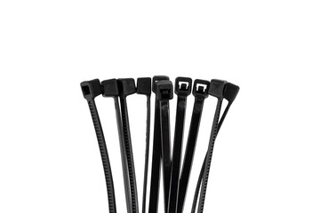 Tie clamps on a white background. Black plastic cable ties clamps close-up.