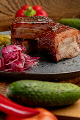 smoked meat with pickled cabbage and pickled cucumbers