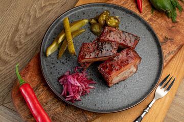 smoked meat with pickled cabbage and pickled cucumbers