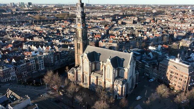 Amsterdam city center aerial drone view of the Westertoren and the Jordaan urban area in the city center of Amsterdam. Along the canals.