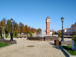A brick restored water tower in the Art Nouveau architectural style rises on the central square of the ancient city of Staraya Russa, Novgorod region.  Industrial architecture of the early XX century. © lara