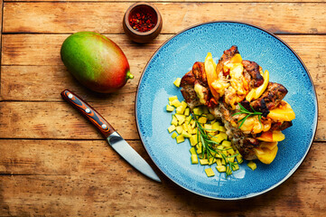 Baked meat with mango