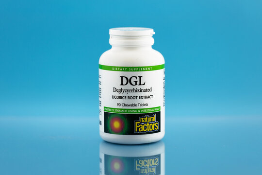 DGL (licorice root extract) chewable tablets in the jar. dietary supplement editorial photo