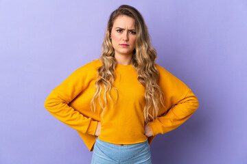 Young Brazilian woman isolated on purple background angry