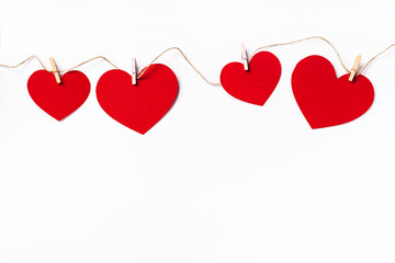 Red hearts background with copy space. Paper cut romantic concept, top view. Valentines Day greeting card concept. White background