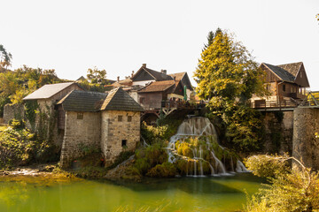 old mill on the river in autumn